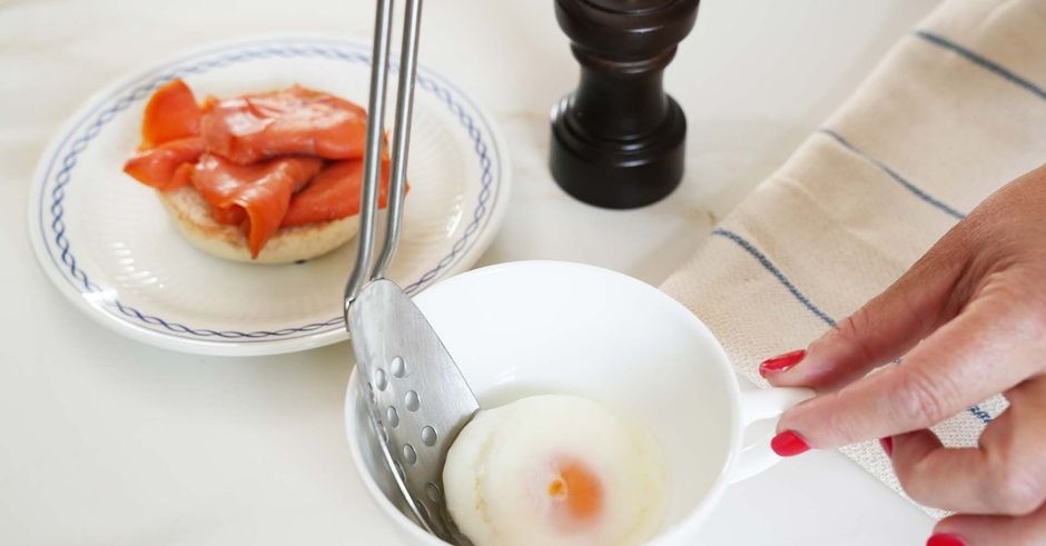 Slotted spoon extracting the egg